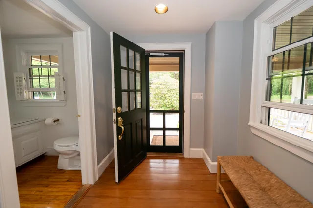 a kitchen with a stove a counter top space and a dining table
