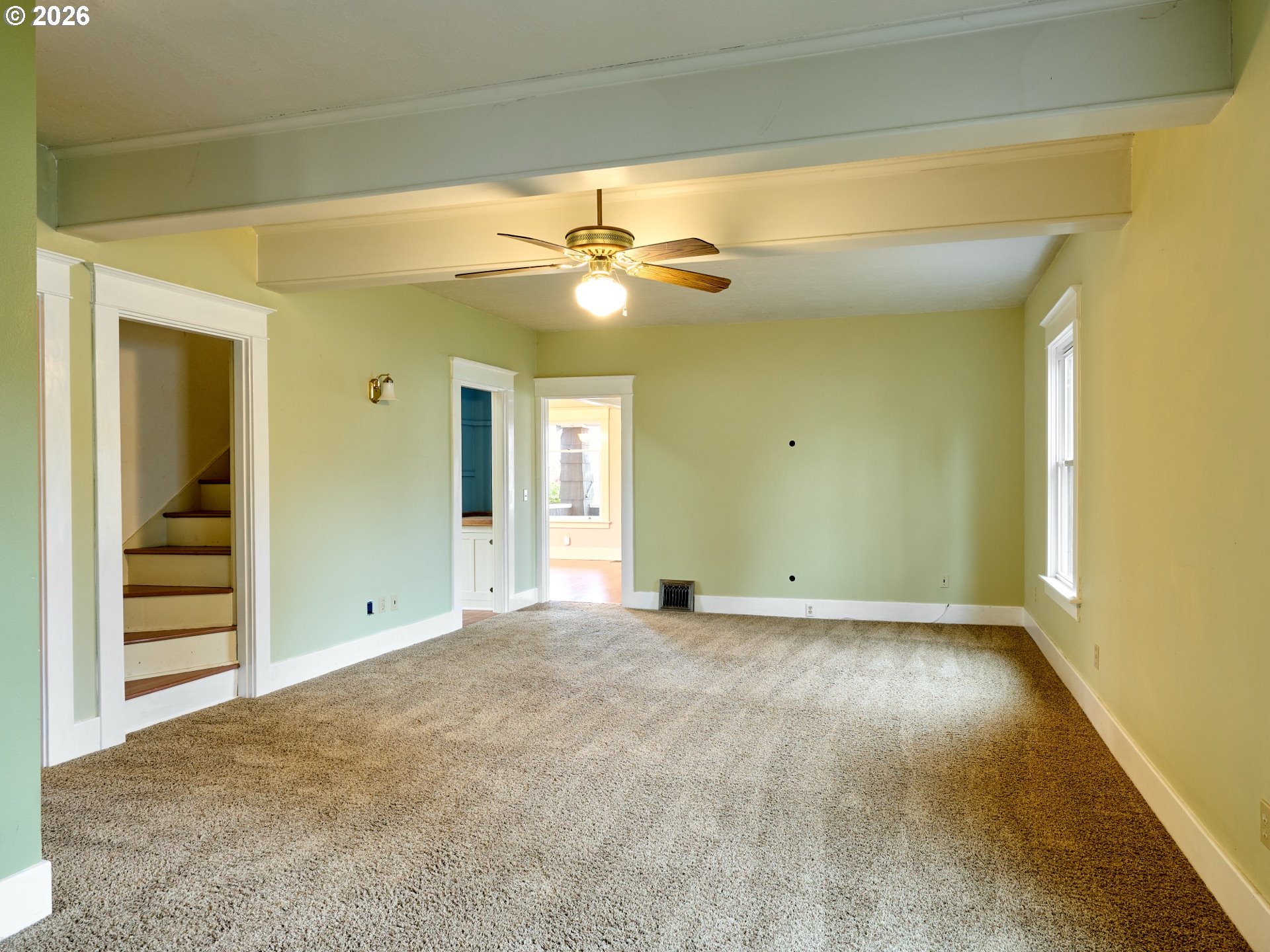 216 South James Street Silverton, OR 97381 - Photo 11 of 31 a view of an empty room with a ceiling fan