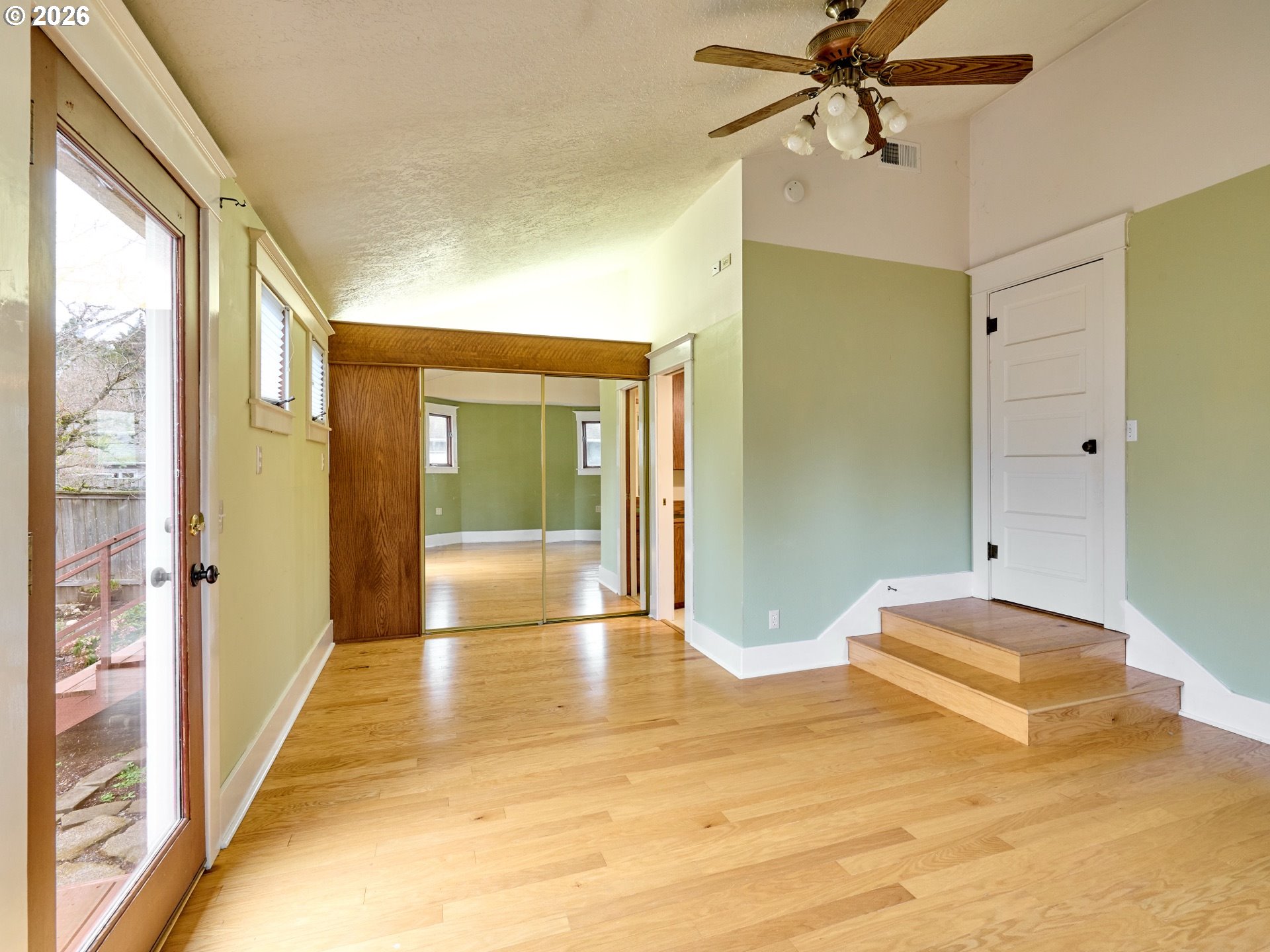 216 South James Street Silverton, OR 97381 - Photo 14 of 31 a view of empty room with wooden floor and fan