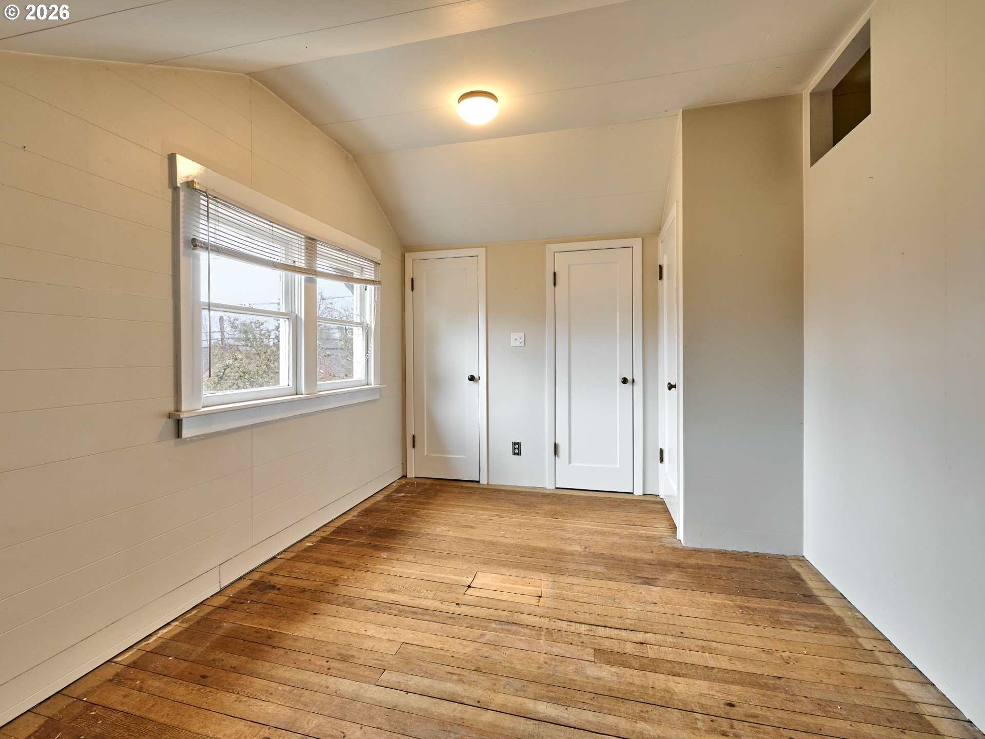216 South James Street Silverton, OR 97381 - Photo 16 of 31 a view of an empty room with wooden floor and a window