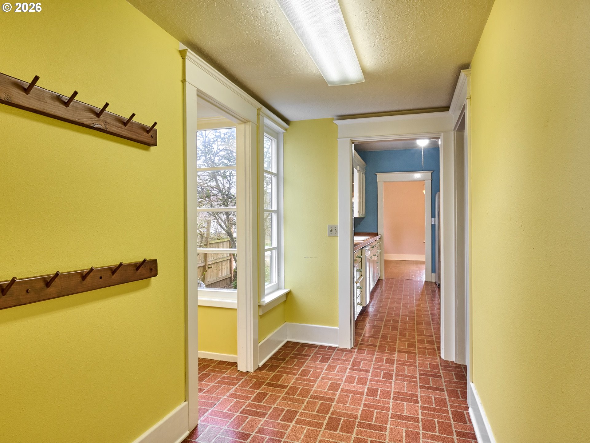 216 South James Street Silverton, OR 97381 - Photo 19 of 31 a view of a hallway with wooden floor and a bathroom