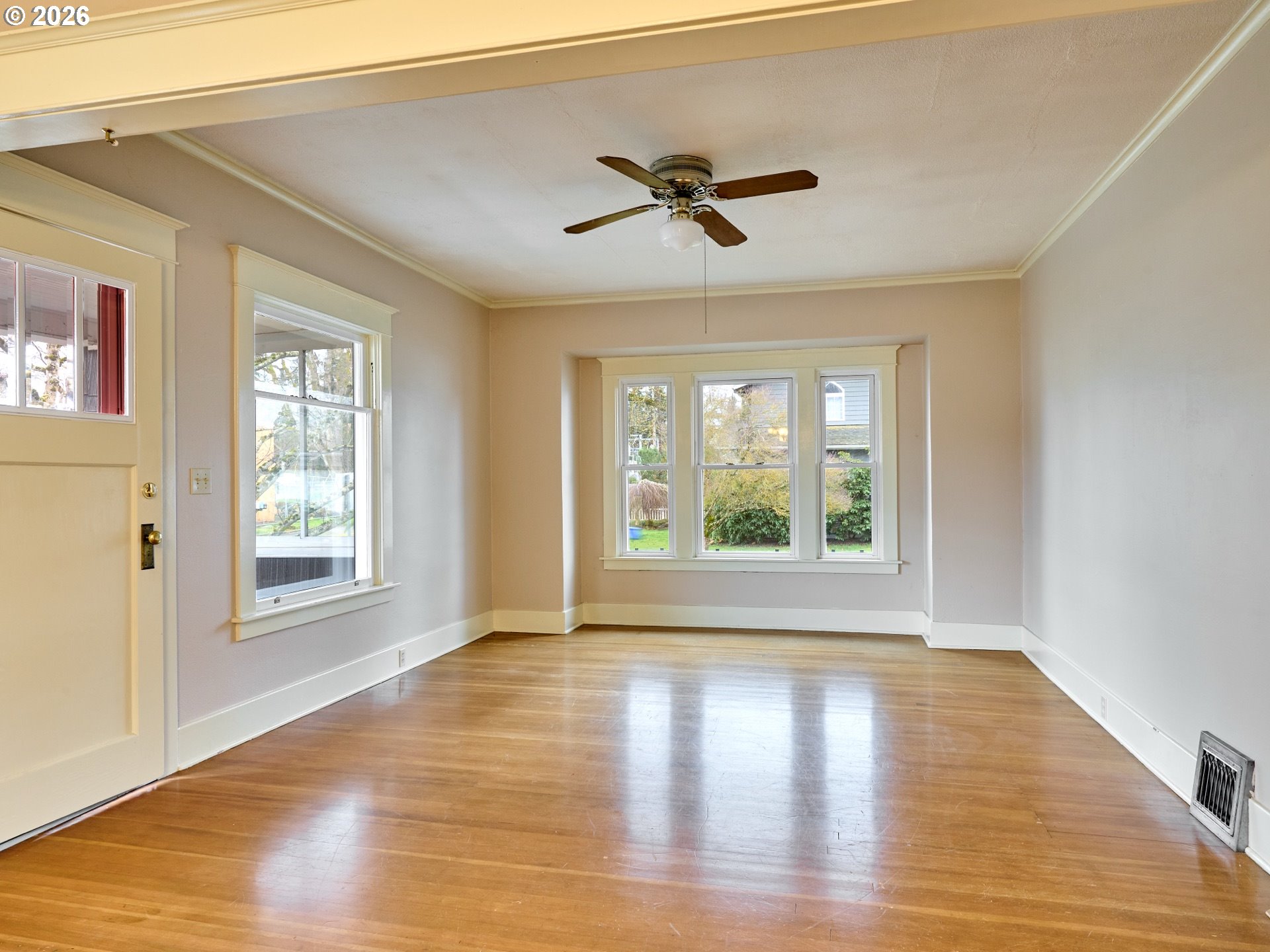 216 South James Street Silverton, OR 97381 - Photo 5 of 31 a view of an empty room with wooden floor and a window
