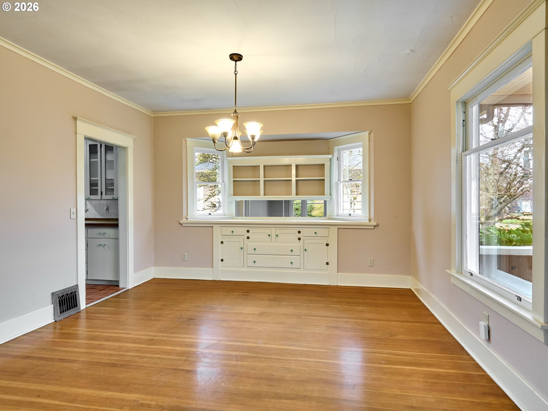 216 South James Street Silverton, OR 97381 - Photo 6 of 31 a view of empty room with wooden floor and fan