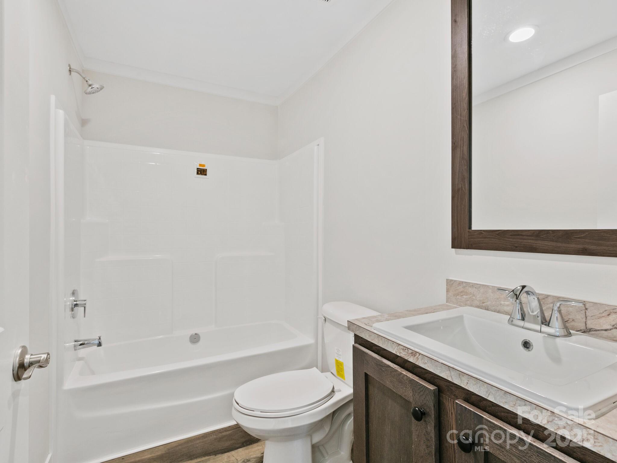 206 Walnut Br Road Weaverville, NC 28787 - Photo 11 of 18 a bathroom with a sink toilet vanity and shower