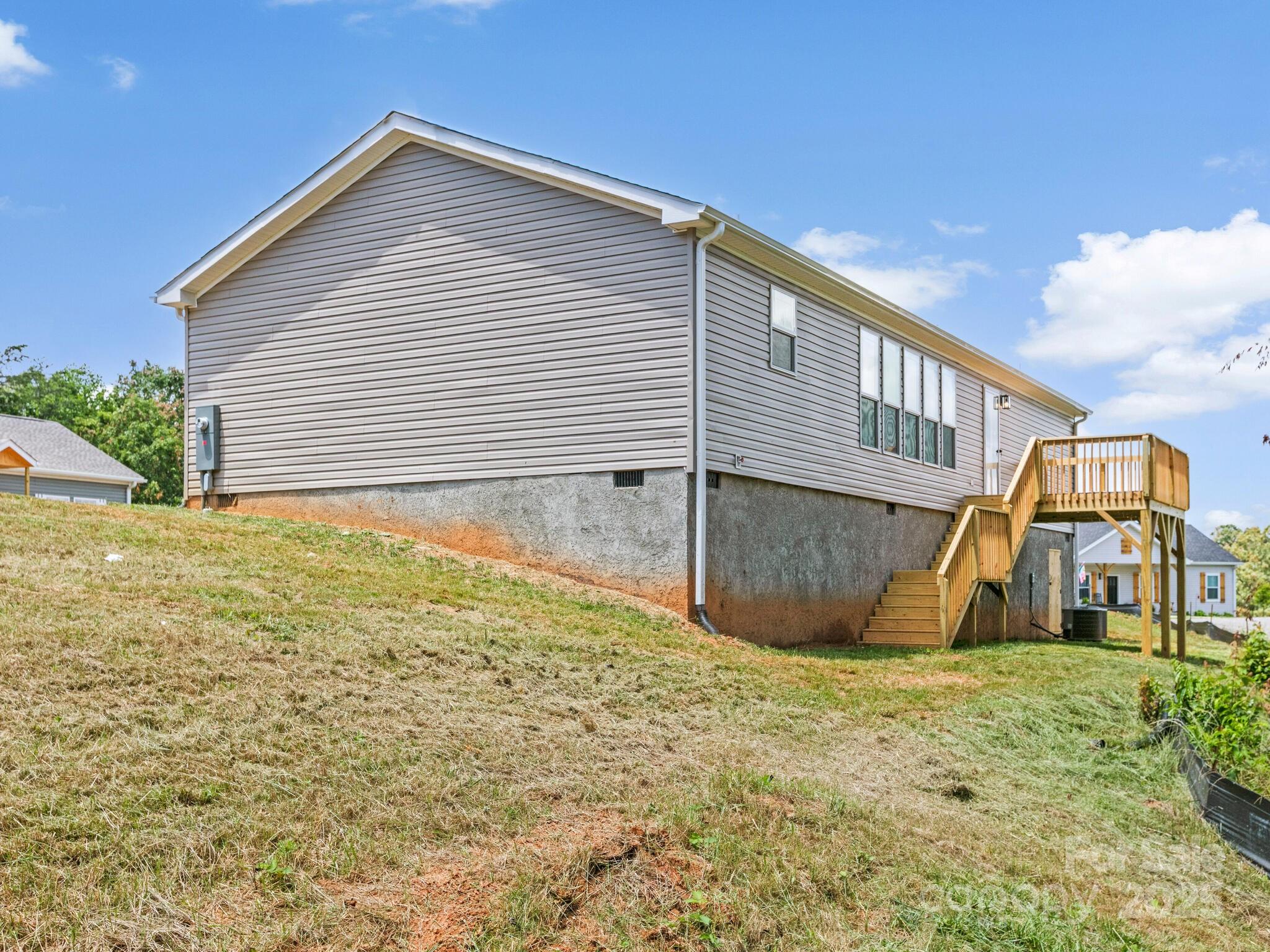 206 Walnut Br Road Weaverville, NC 28787 - Photo 15 of 18 a view of an house with backyard and sitting area