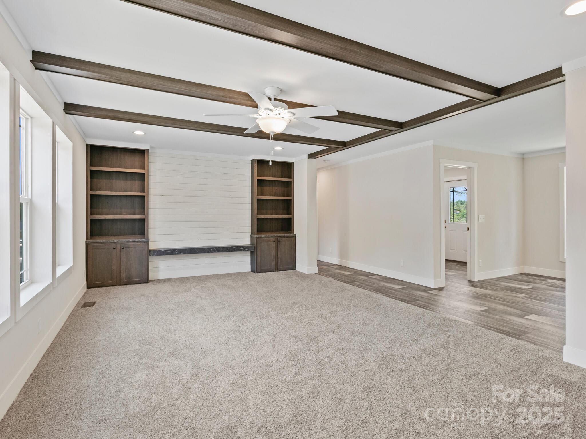 206 Walnut Br Road Weaverville, NC 28787 - Photo 3 of 18 a view of an empty room with a ceiling fan