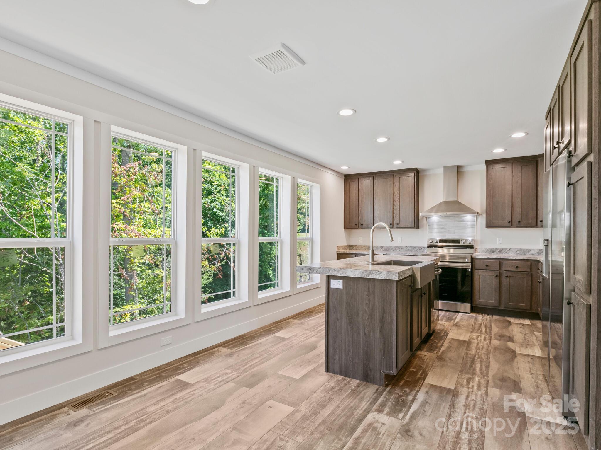 206 Walnut Br Road Weaverville, NC 28787 - Photo 6 of 18 a kitchen with a sink a counter top space and stainless steel appliances
