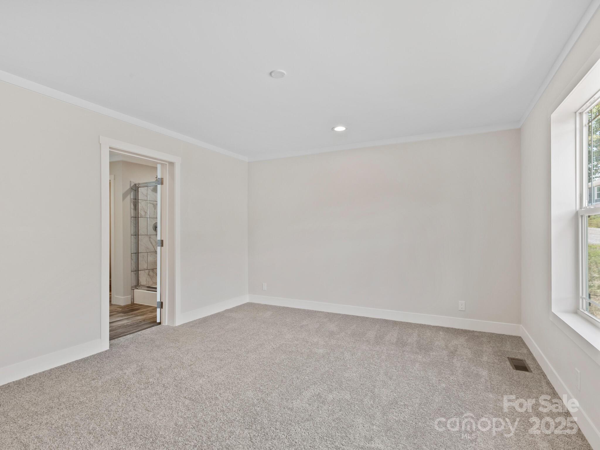 206 Walnut Br Road Weaverville, NC 28787 - Photo 7 of 18 an empty room with a window