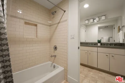 a bathroom with a bathtub and a sink