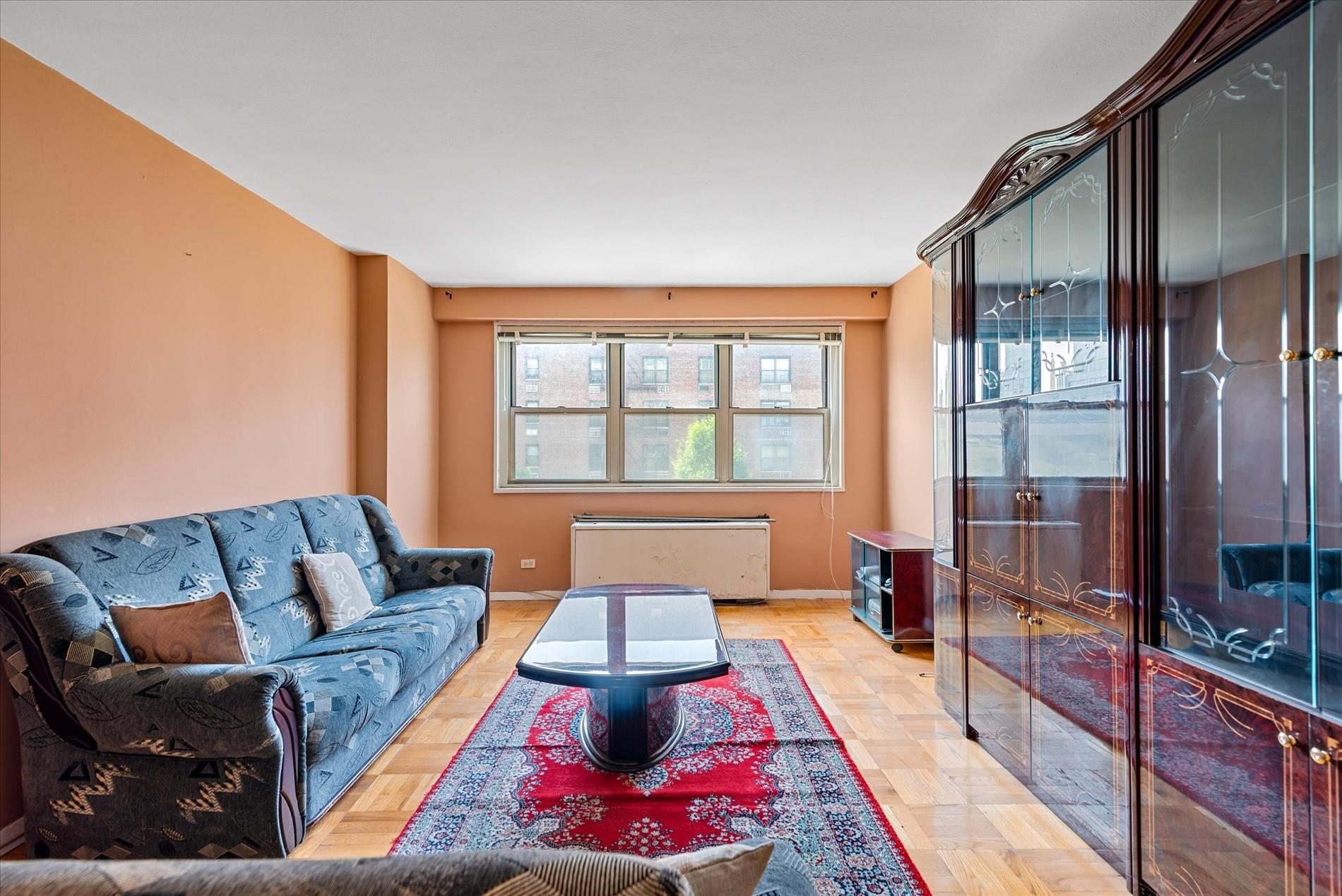 102-30 66th Road, Unit 4B Queens, NY 11375 - Photo 1 of 26 a living room with furniture and a window