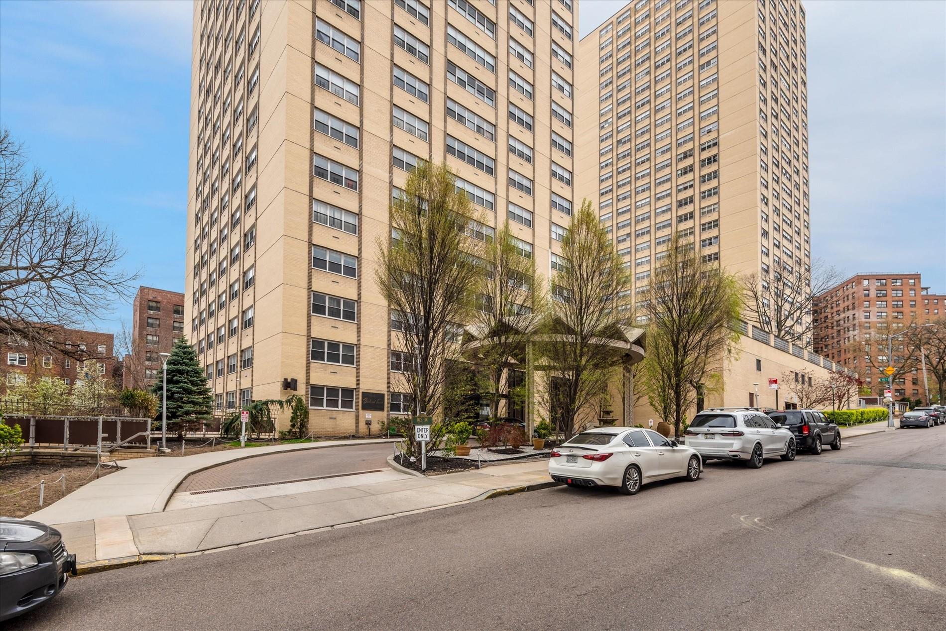 102-30 66th Road, Unit 4B Queens, NY 11375 - Photo 18 of 26 a car parked in front of a building