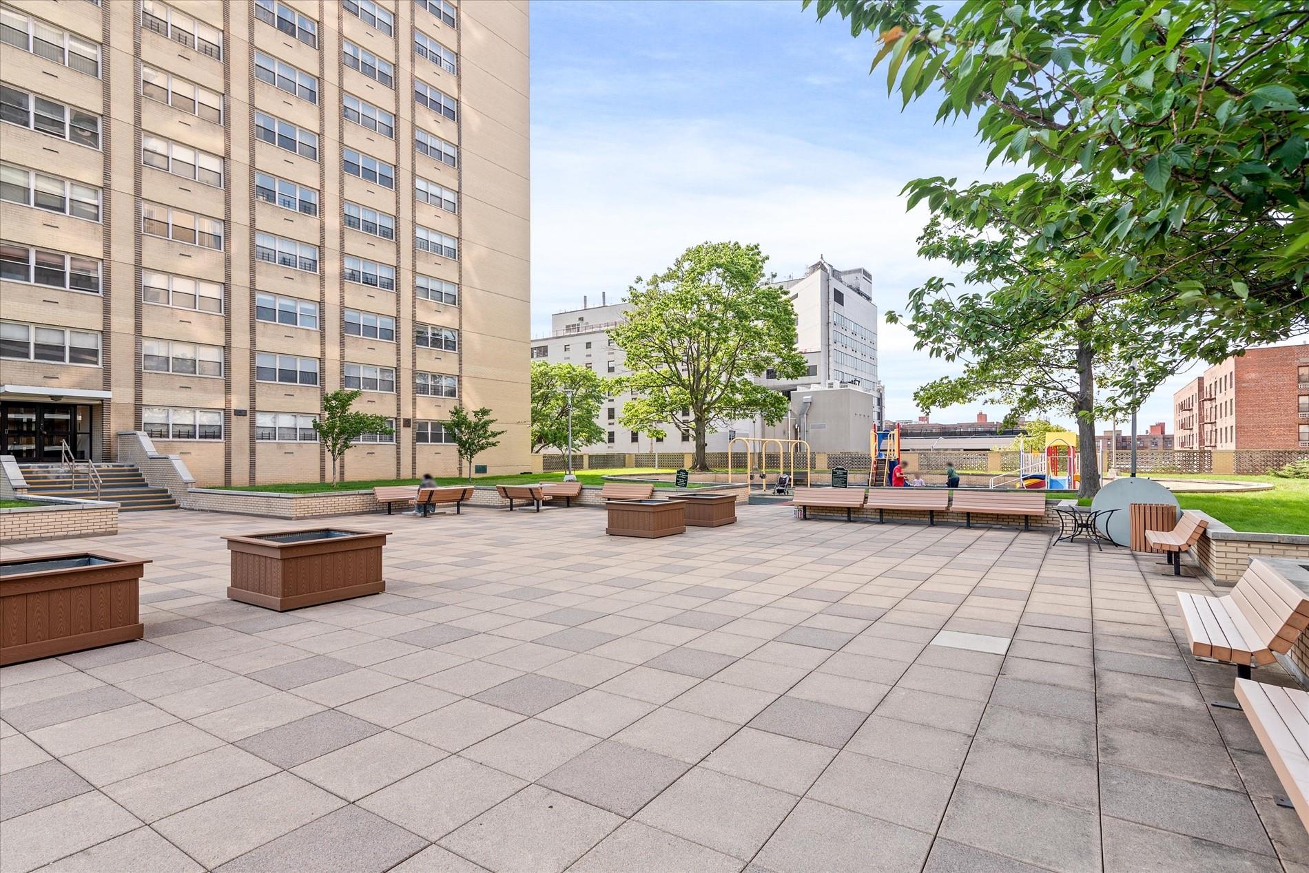 102-30 66th Road, Unit 4B Queens, NY 11375 - Photo 20 of 26 a swimming pool with outdoor seating