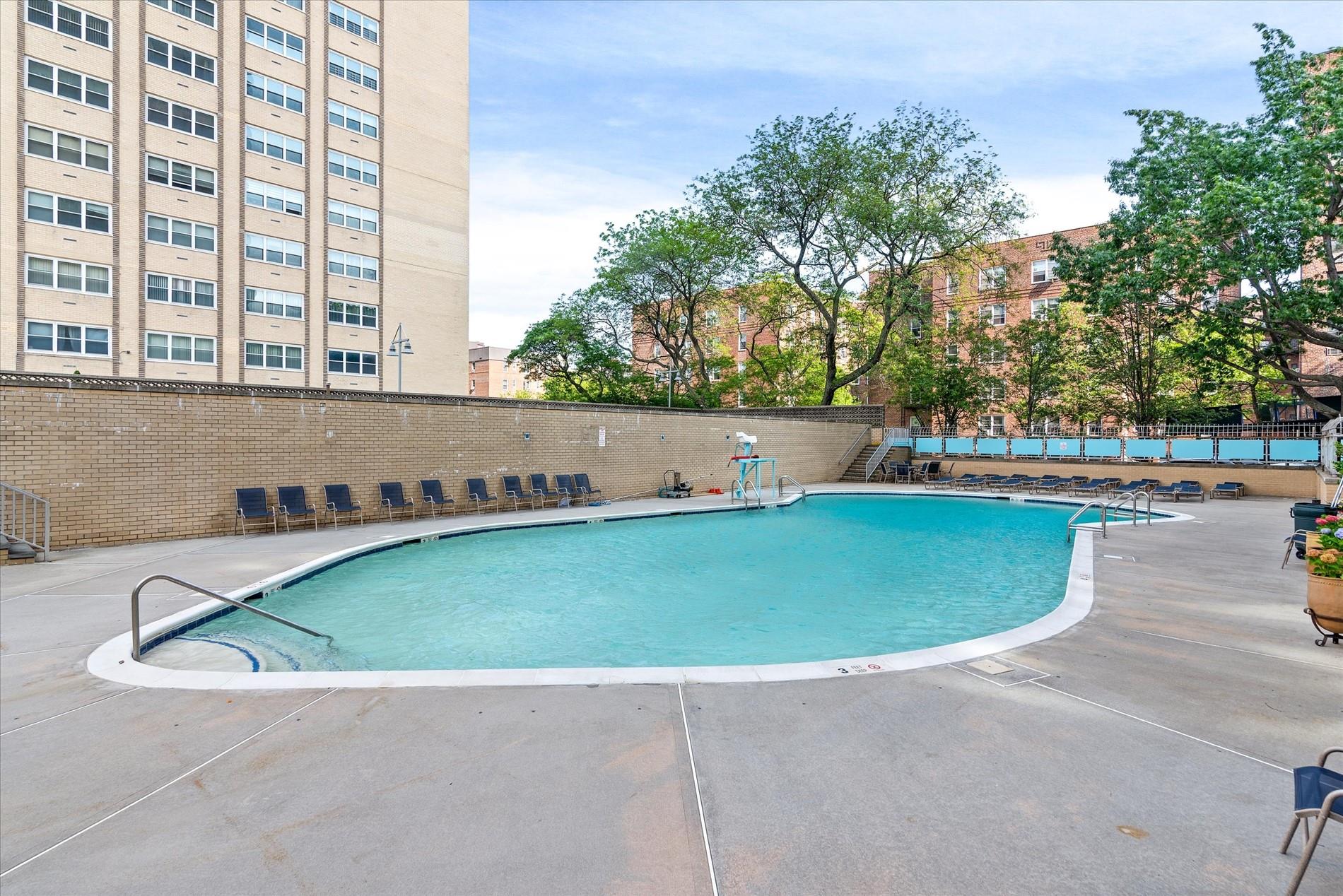 102-30 66th Road, Unit 4B Queens, NY 11375 - Photo 22 of 26 a view of outdoor space swimming pool and outdoor seating