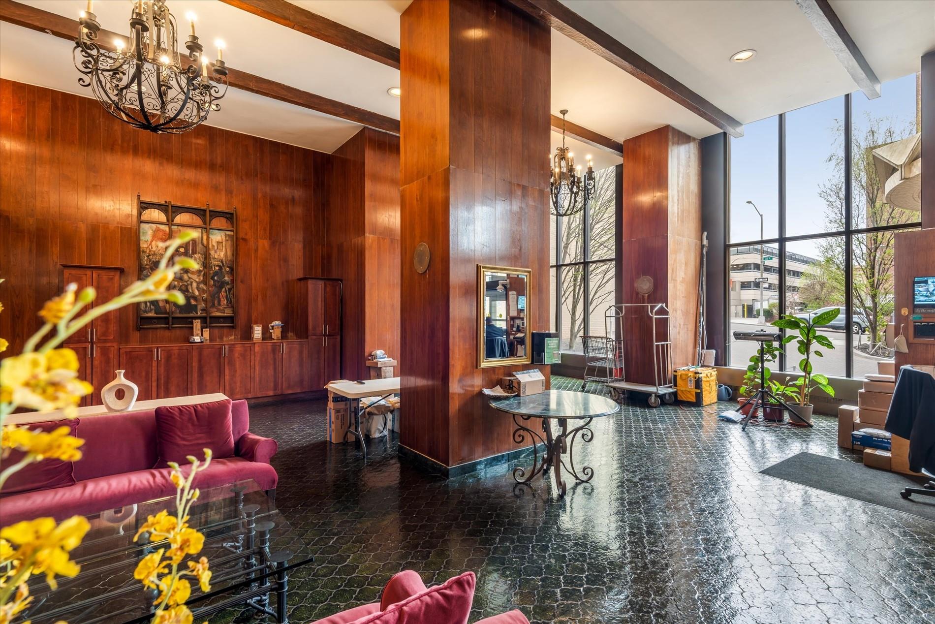 102-30 66th Road, Unit 4B Queens, NY 11375 - Photo 23 of 26 a living room with fireplace furniture and a large window