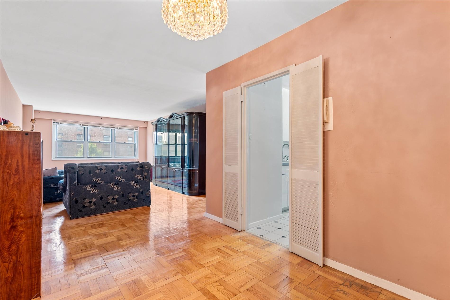 102-30 66th Road, Unit 4B Queens, NY 11375 - Photo 4 of 26 a bathroom with a tub shower and mirror