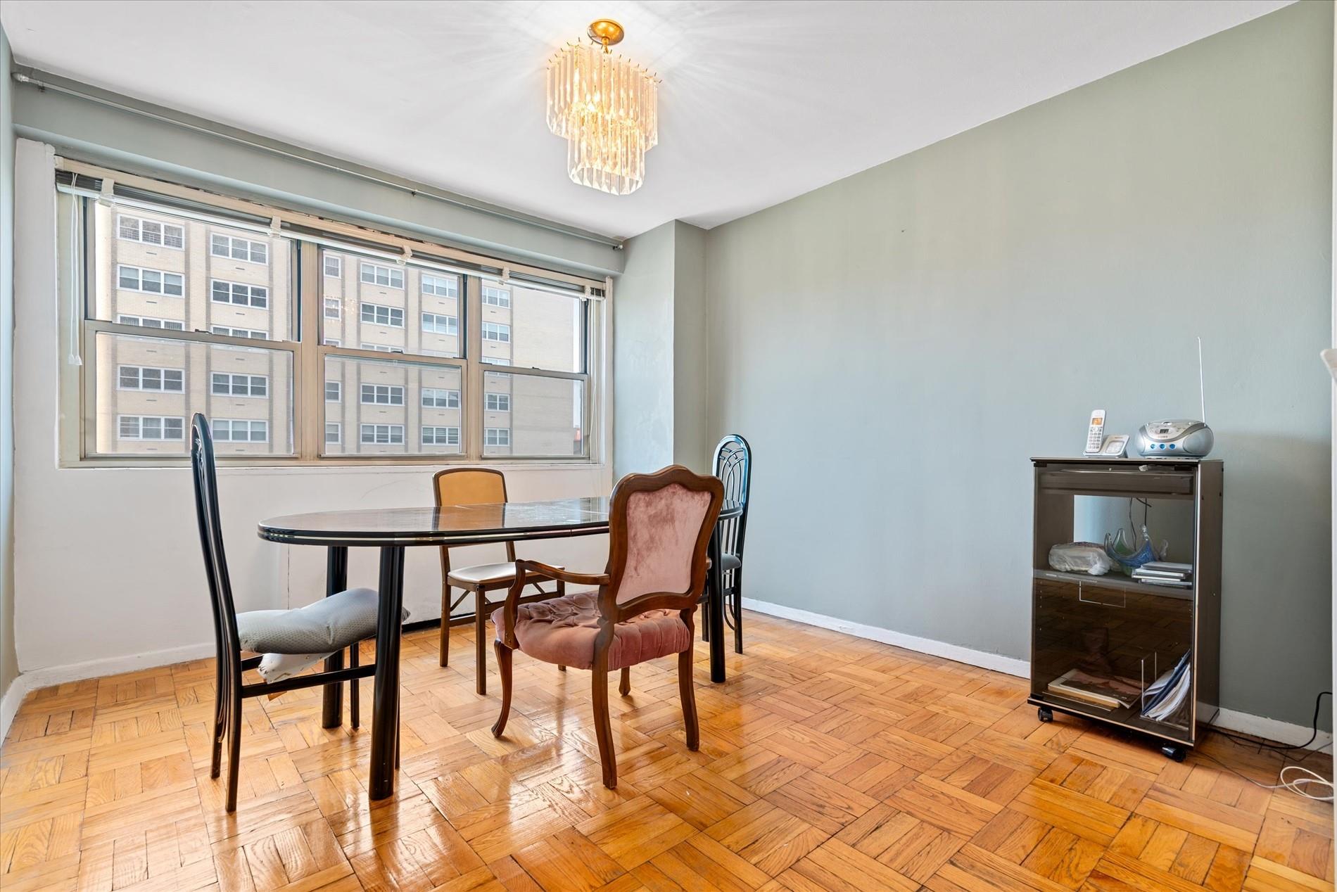 102-30 66th Road, Unit 4B Queens, NY 11375 - Photo 10 of 26 a view of a dining room with furniture window and outside view
