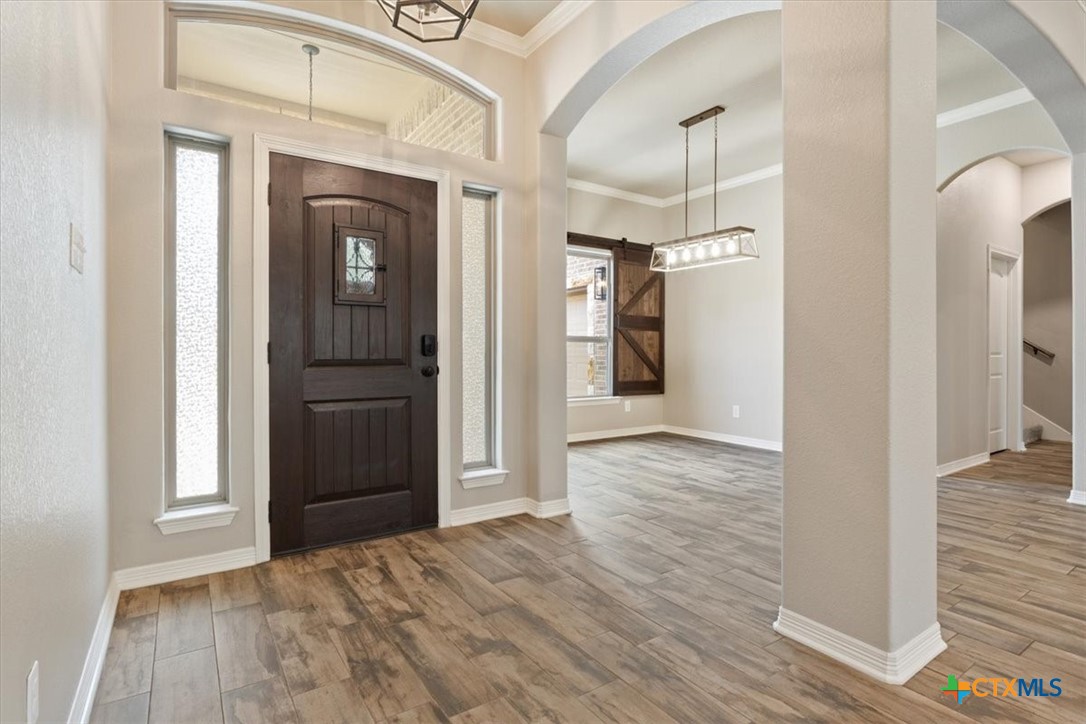 4 Salta Court Belton, TX 76513 - Photo 11 of 45 a view of a hallway with wooden floor and staircase