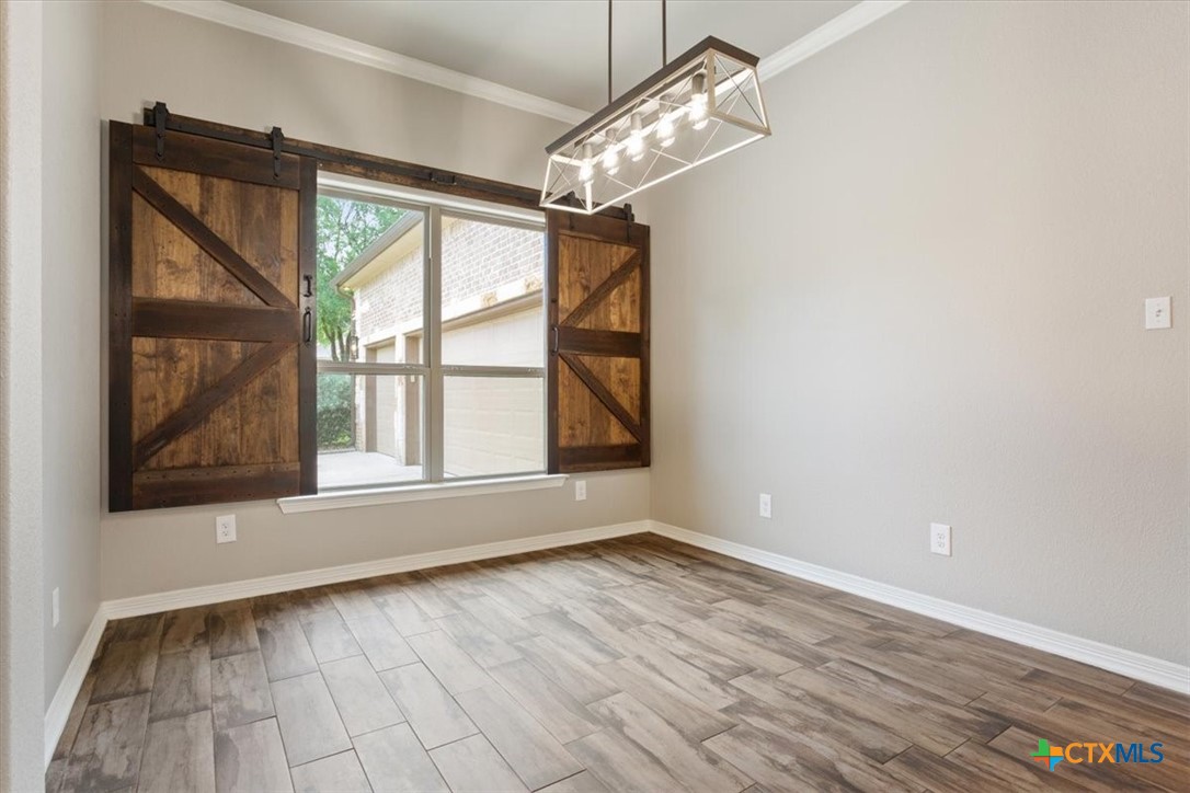 4 Salta Court Belton, TX 76513 - Photo 13 of 45 a view of empty room with wooden floor and fan