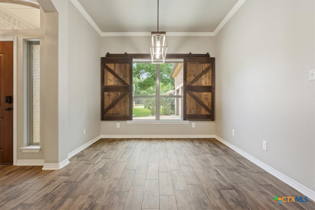 4 Salta Court Belton, TX 76513 - Photo 14 of 45 a view of empty room with wooden floor and fan