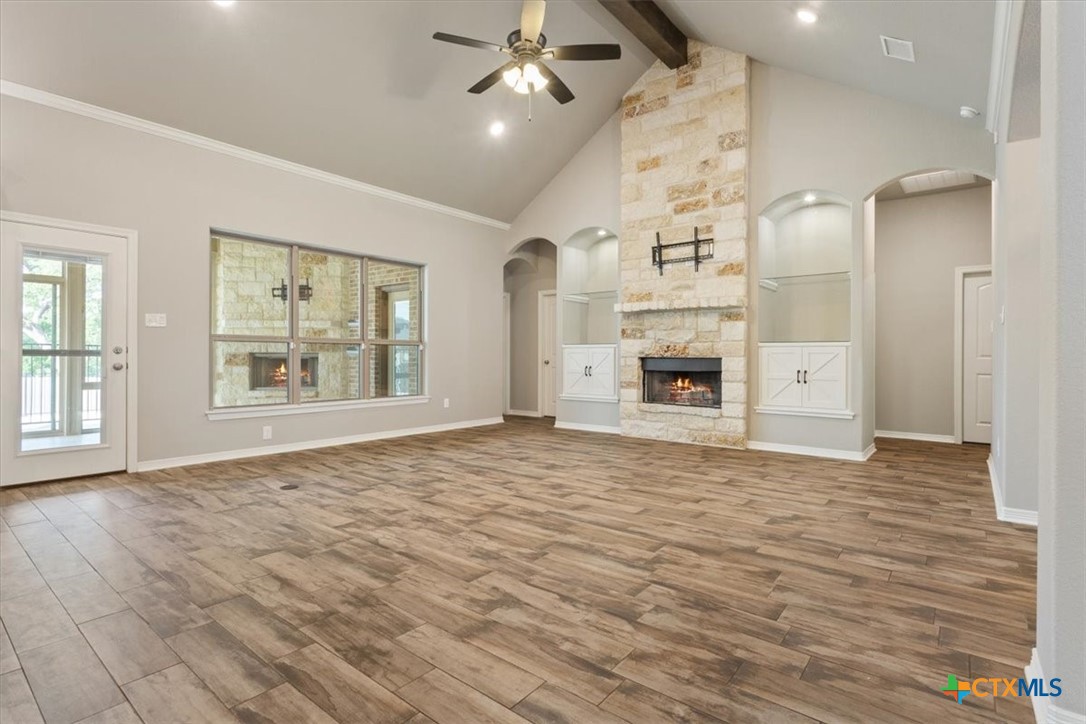 4 Salta Court Belton, TX 76513 - Photo 16 of 45 an empty room with large windows and fireplace