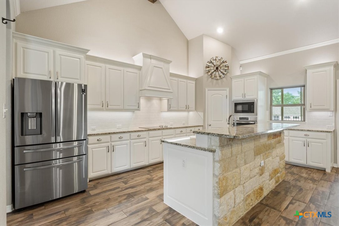 4 Salta Court Belton, TX 76513 - Photo 21 of 45 a kitchen with stainless steel appliances granite countertop a refrigerator sink and cabinets