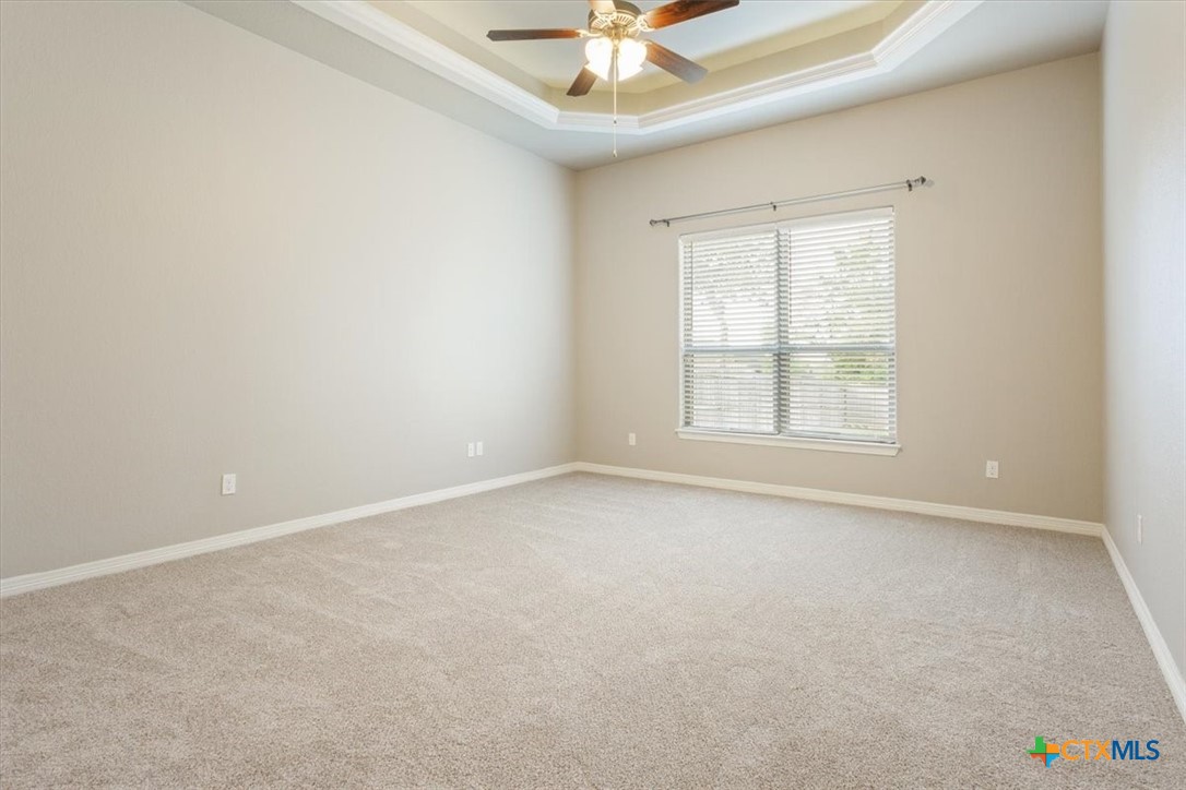 4 Salta Court Belton, TX 76513 - Photo 25 of 45 an empty room with a window and a ceiling fan