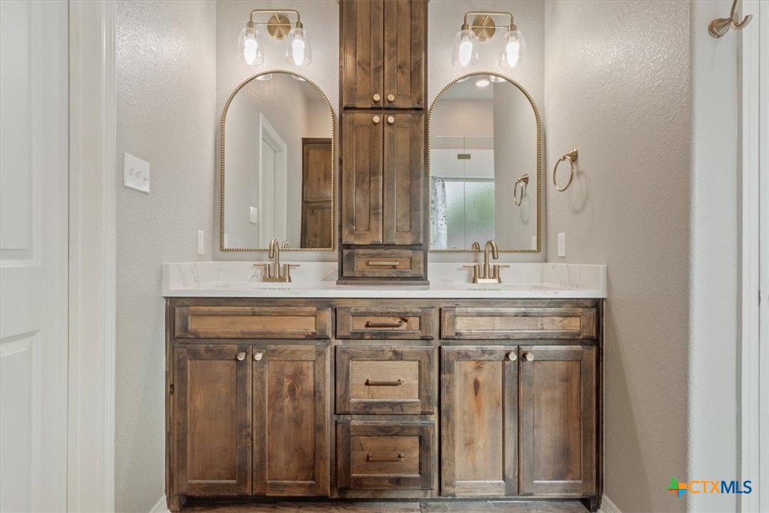 4 Salta Court Belton, TX 76513 - Photo 29 of 45 a bathroom with double vanity sinks and a mirror