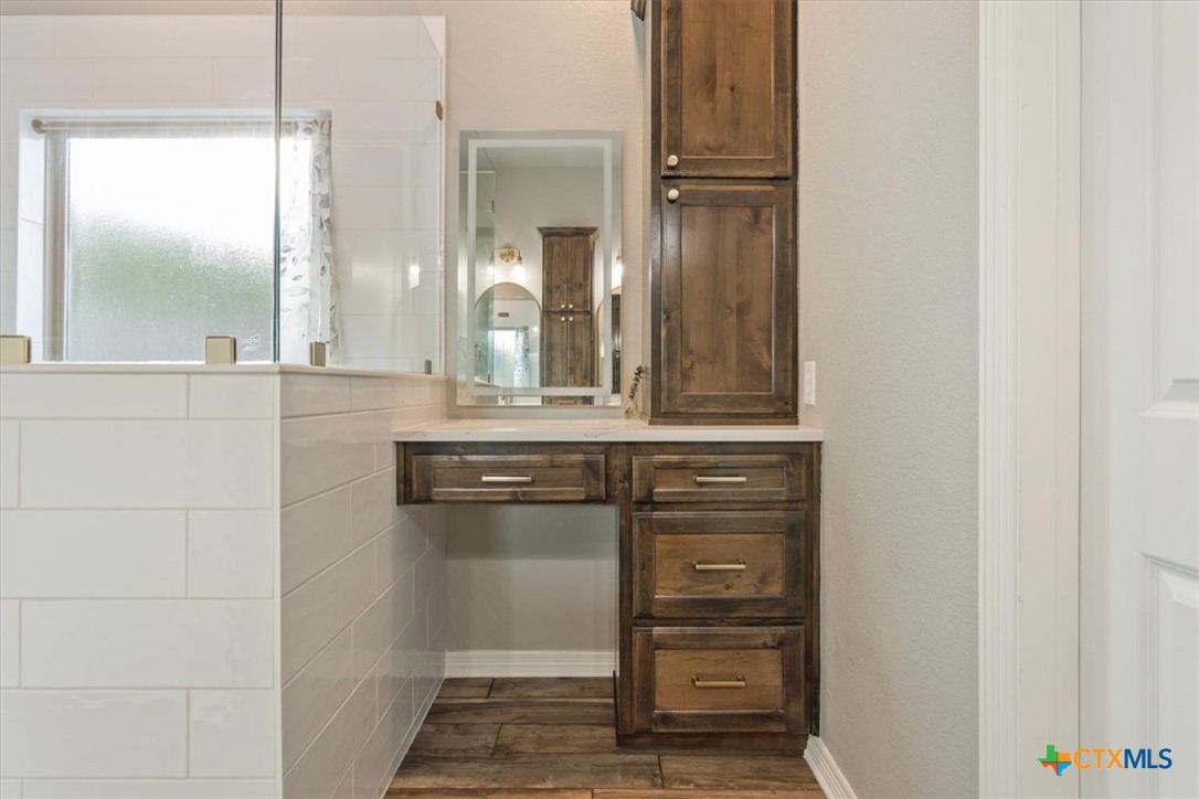 4 Salta Court Belton, TX 76513 - Photo 30 of 45 a bathroom with a granite countertop sink and a mirror