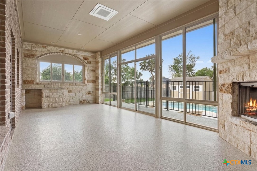 4 Salta Court Belton, TX 76513 - Photo 4 of 45 a view of empty room with floor to ceiling window and wooden floor
