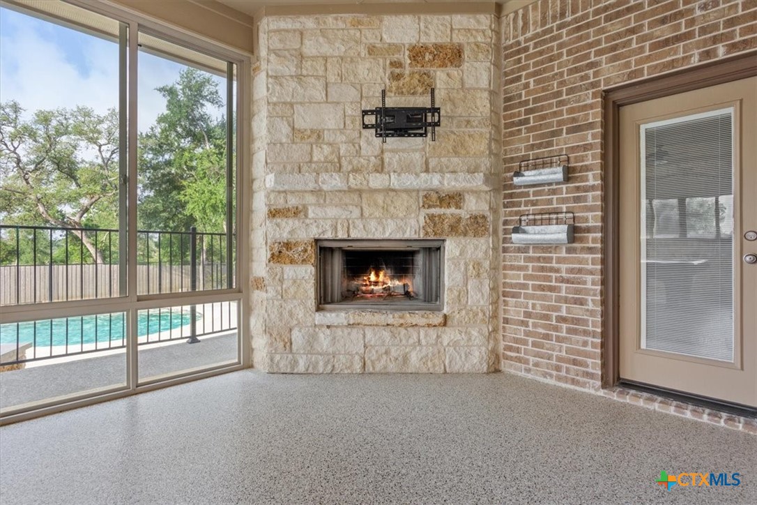 4 Salta Court Belton, TX 76513 - Photo 5 of 45 a view of empty room with fireplace and wooden floor