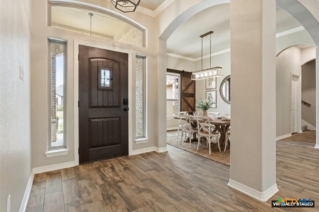 4 Salta Court Belton, TX 76513 - Photo 10 of 45 a view of a hallway with wooden floor and dining room