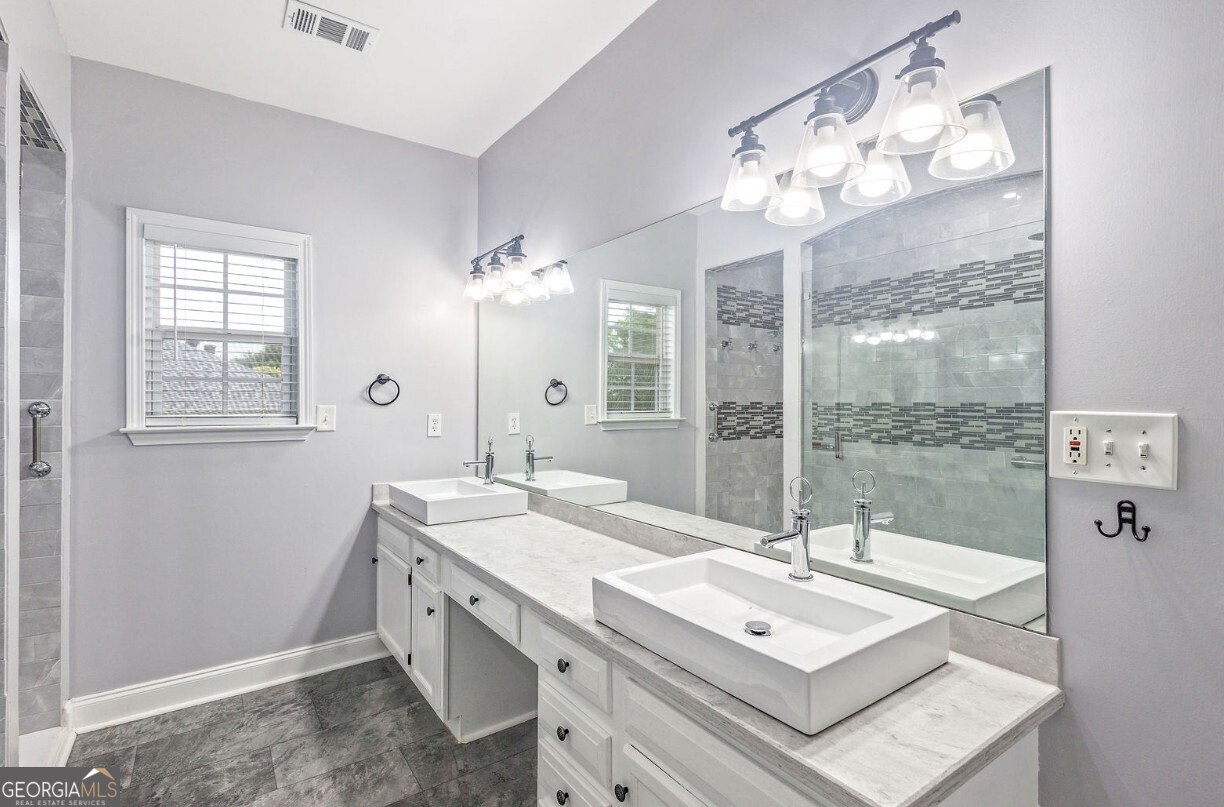 82 Newton Road LaGrange, GA 30240 - Photo 24 of 45 a bathroom with a sink double vanity and a mirror
