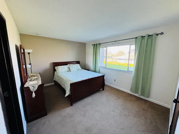 a room with a bed and a window
