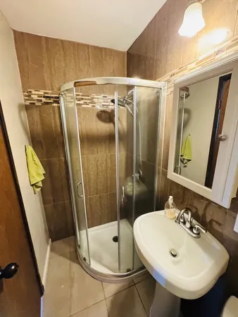 a bathroom with a sink and mirror
