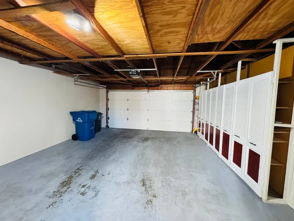 a view of an empty room with wooden walls