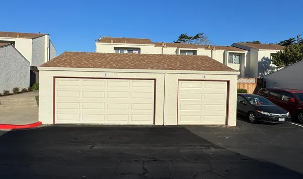 a view of a house with a parking space