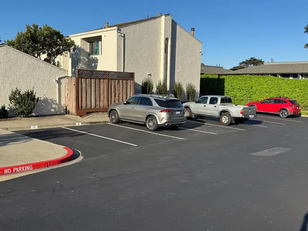 a view of street with parked cars