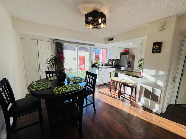 a view of a dining room with furniture and a livingroom