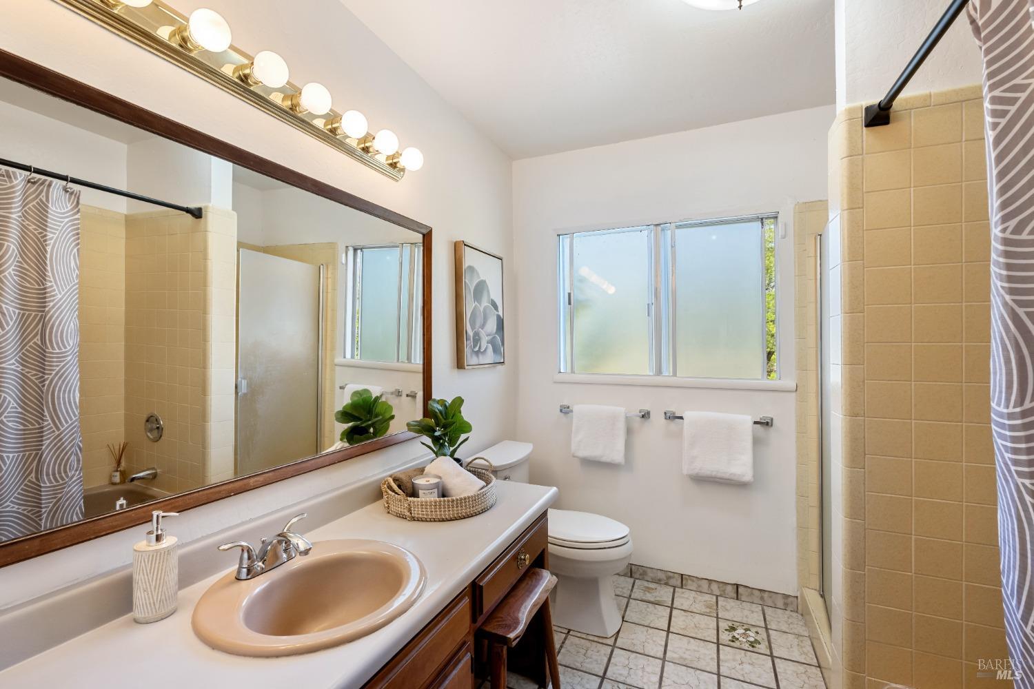 12600 Henno Road Glen Ellen, CA 95442 - Photo 26 of 45 a bathroom with a sink and a mirror