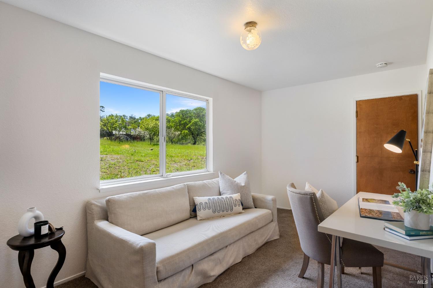12600 Henno Road Glen Ellen, CA 95442 - Photo 27 of 45 a living room with furniture and a window