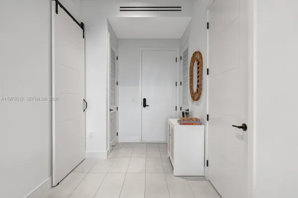 a view of a storage & utility room with a sink