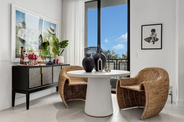 a dining room with furniture and window