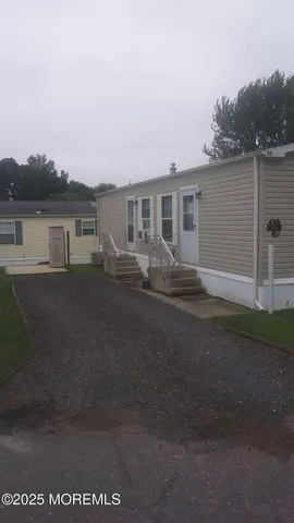 a backyard of a house with wooden fence