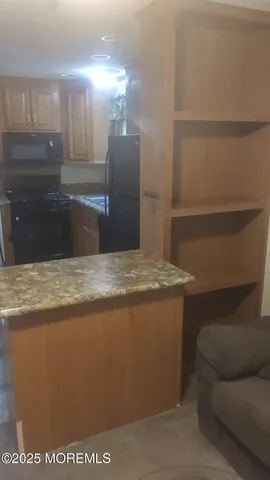 a view of kitchen and cabinets