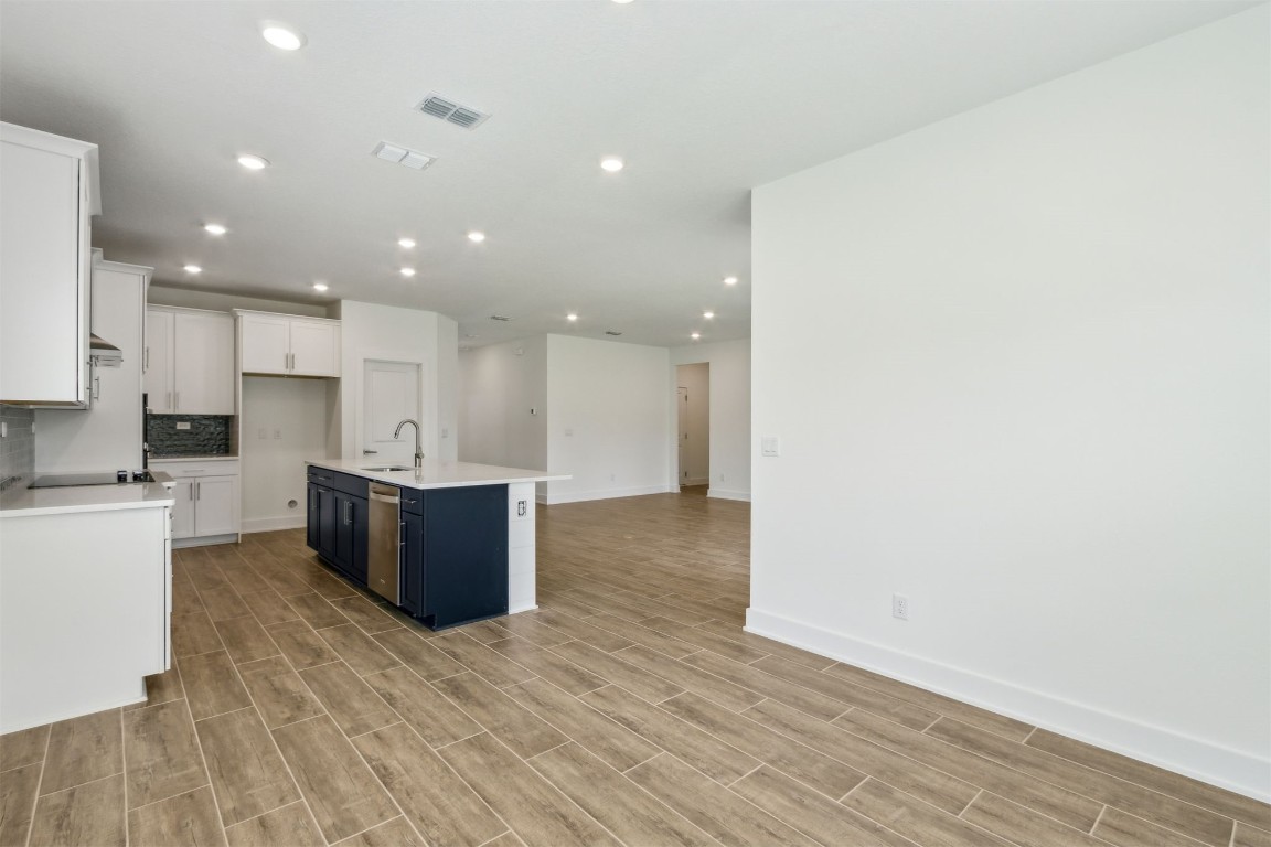 96100 Pirates Bluff Road Yulee, FL 32097 - Photo 15 of 39 a large kitchen with stainless steel appliances granite countertop a granite counter tops and a wooden floors