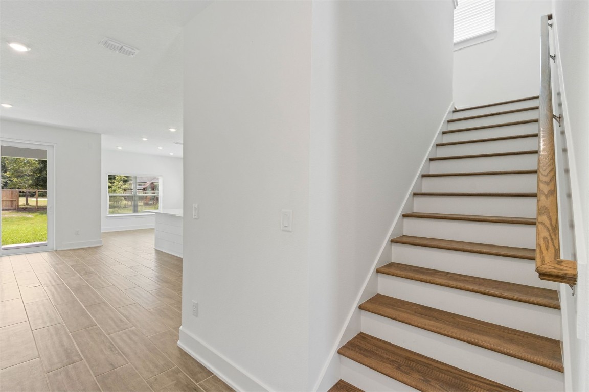 96100 Pirates Bluff Road Yulee, FL 32097 - Photo 17 of 39 a view of entryway and hall with wooden floor