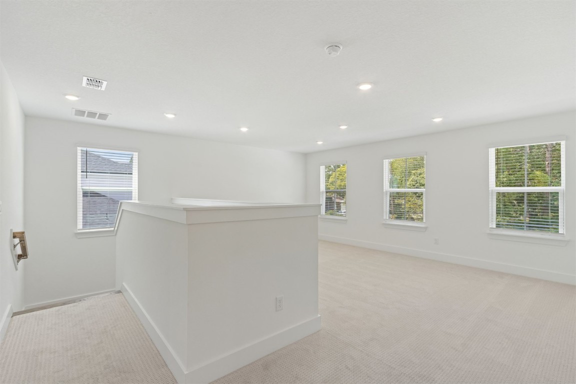 96100 Pirates Bluff Road Yulee, FL 32097 - Photo 18 of 39 an empty room with windows