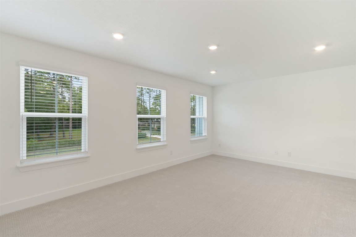 96100 Pirates Bluff Road Yulee, FL 32097 - Photo 21 of 39 an empty room with windows