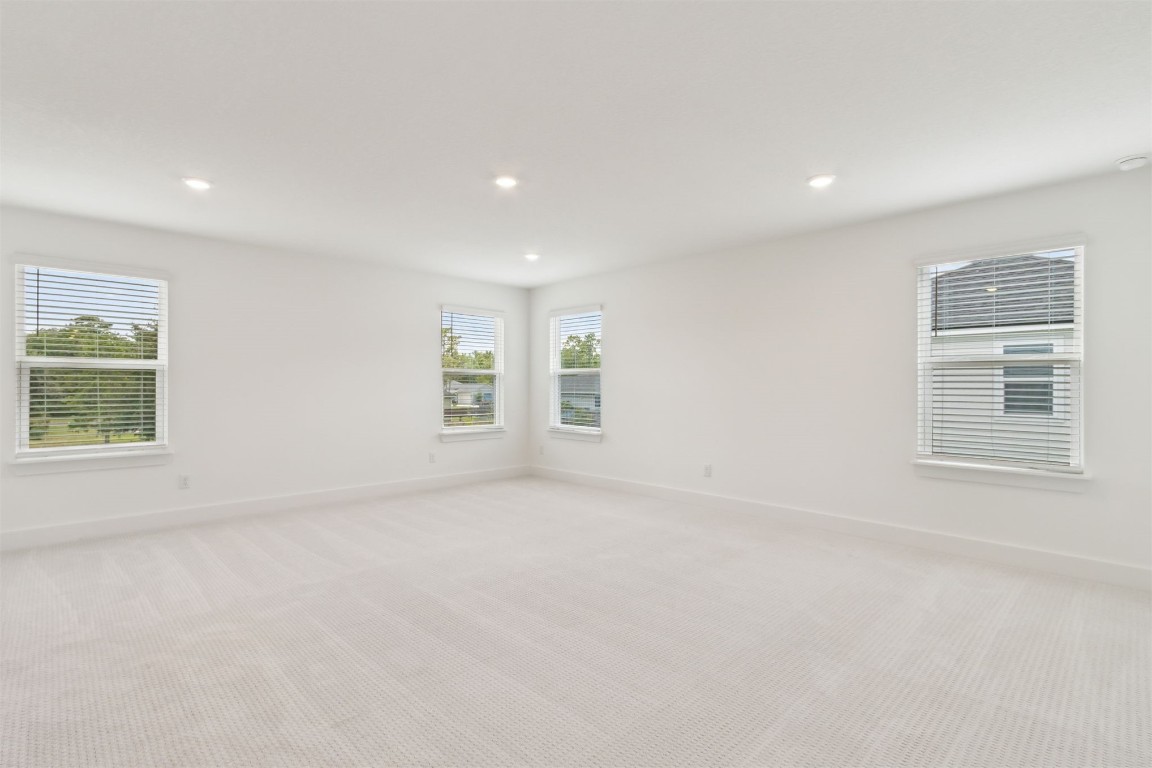 96100 Pirates Bluff Road Yulee, FL 32097 - Photo 23 of 39 an empty room with windows