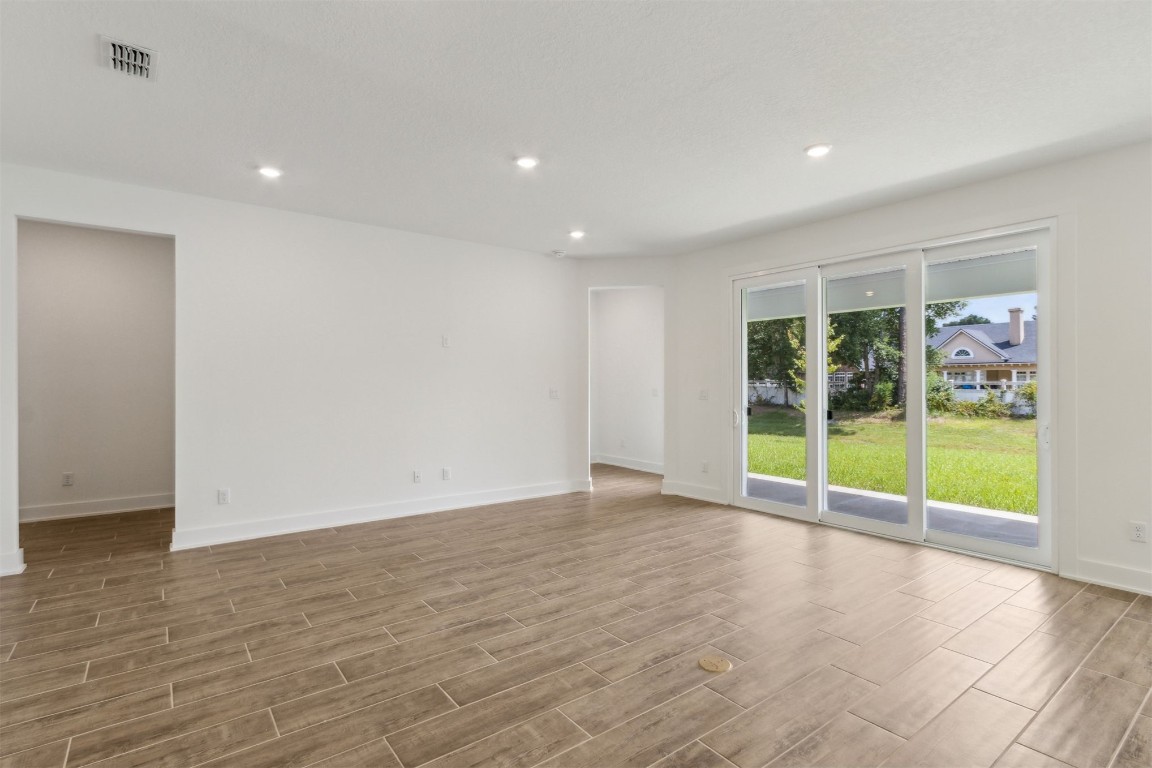 96100 Pirates Bluff Road Yulee, FL 32097 - Photo 5 of 39 a view of an empty room with glass door